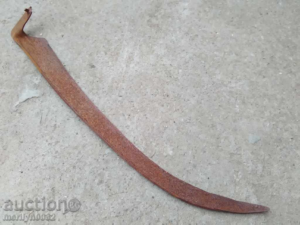 Old hand-forged mowing hair, wrought iron