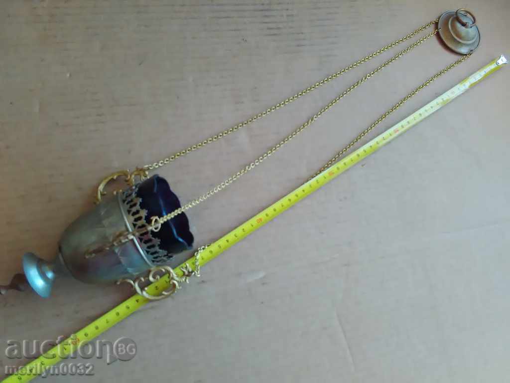 Delivery of An old home-made bronze candela with a glass cup Delivery of An old home-made bronze candela with a glass cup
