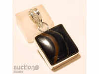 Art medallion, pendant made of tiger's eye