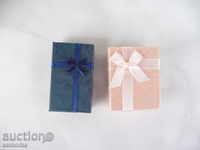 Two small gift boxes blue and pink
