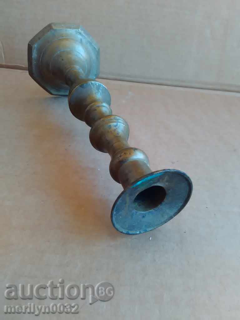 Auction  An Ottoman candlestick with a candle, a candle, a lamp