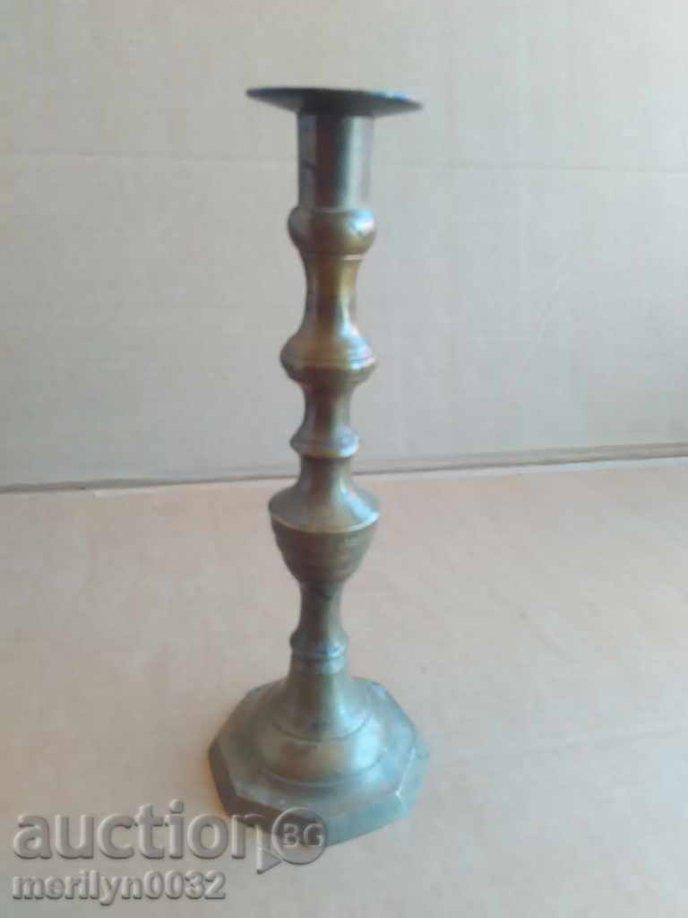 An Ottoman candlestick with a candle, a candle, a lamp