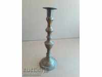 An Ottoman candlestick with a candle, a candle, a lamp