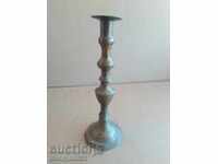 An Ottoman candlestick with a candle, a candle, a lamp