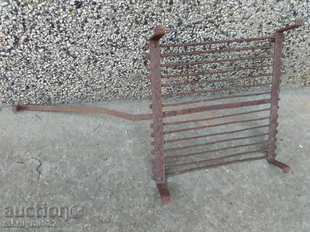 Delivery of An old hand-forged grill, a steak, wrought iron Delivery of An old hand-forged grill, a steak, wrought iron