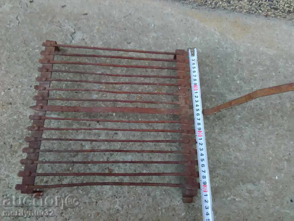 An old hand-forged grill, a steak, wrought iron - 5 An old hand-forged grill, a steak, wrought iron - 5