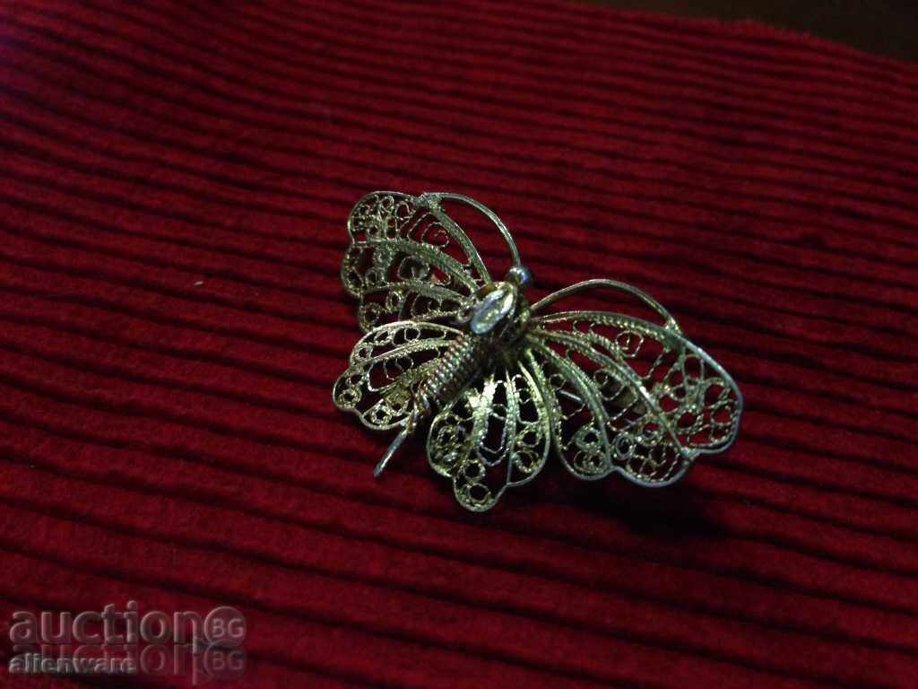Delivery of Brooch-butterfly from silver filigree Delivery of Brooch-butterfly from silver filigree