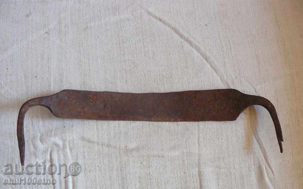 Old manual forged woodcutter knife