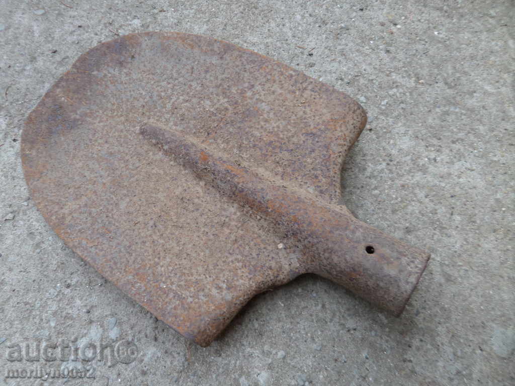 An old straight shovel without a scraped iron tool