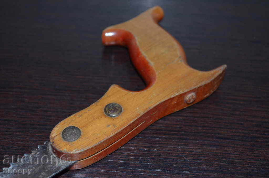Auction Old steel saw with a wooden handle Auction Old steel saw with a wooden handle