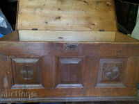 An old large chest for a bridal chaise adjoined a chest of drawers