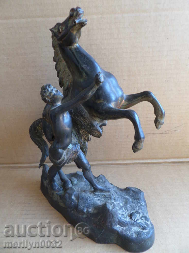 Statue boy leads horse figure from tsim sculpture