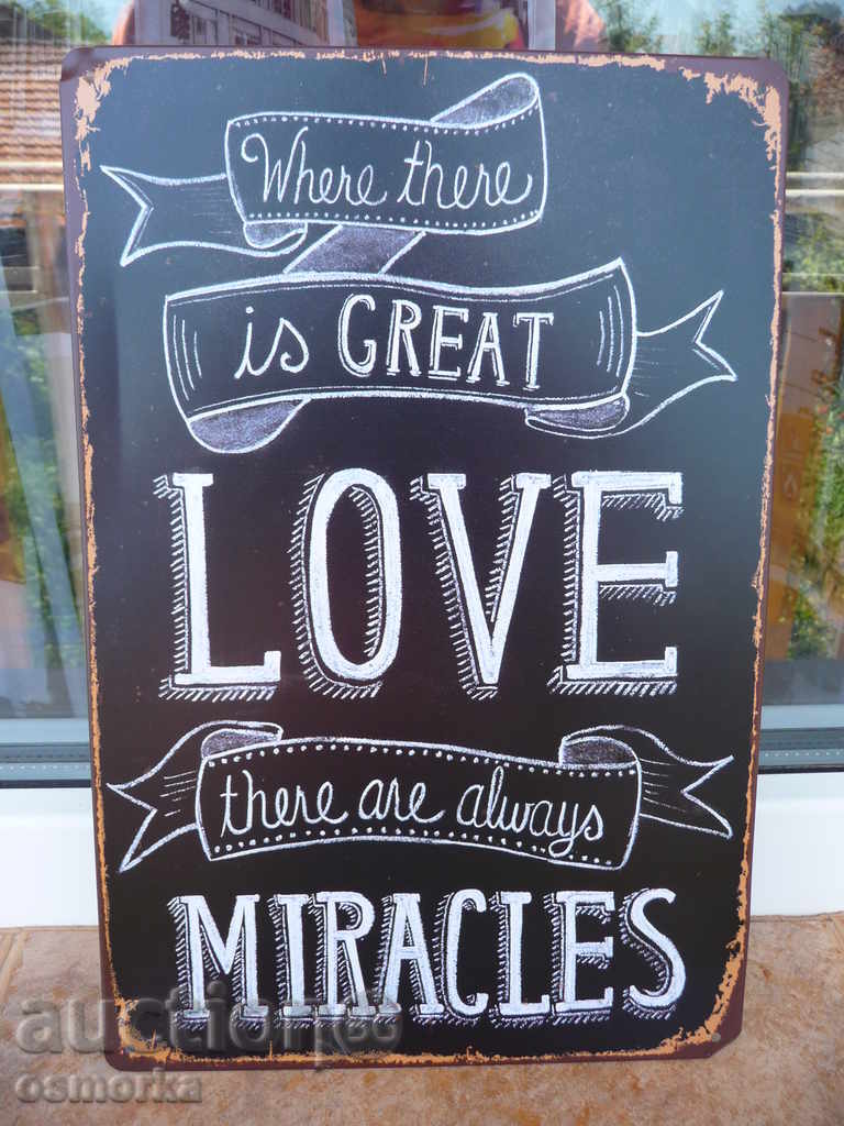 Metal sign lettering message Great love makes miracles