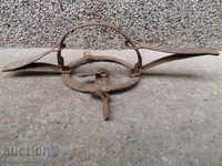 Old hand forged trap with wrought iron spikes