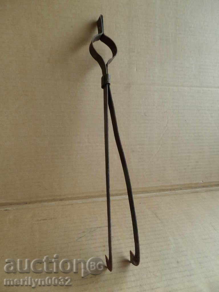 Auction Old hand-forged dilaf, wrought iron, tongs Auction Old hand-forged dilaf, wrought iron, tongs
