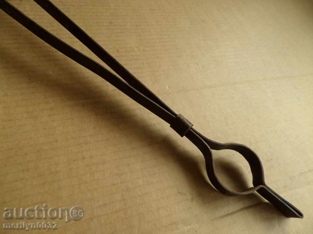 Delivery of Old hand-forged dilaf, wrought iron, tongs Delivery of Old hand-forged dilaf, wrought iron, tongs