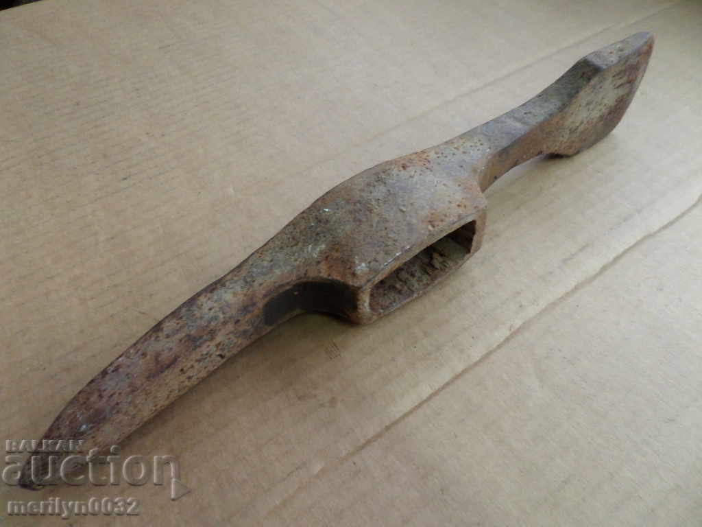 An old hand-forged tool forged wrought iron An old hand-forged tool forged wrought iron