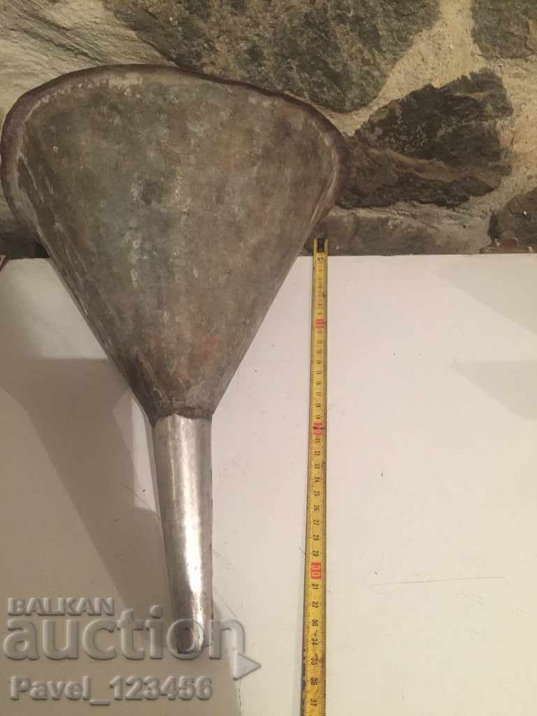 Delivery of big, old, metal funnel Delivery of big, old, metal funnel
