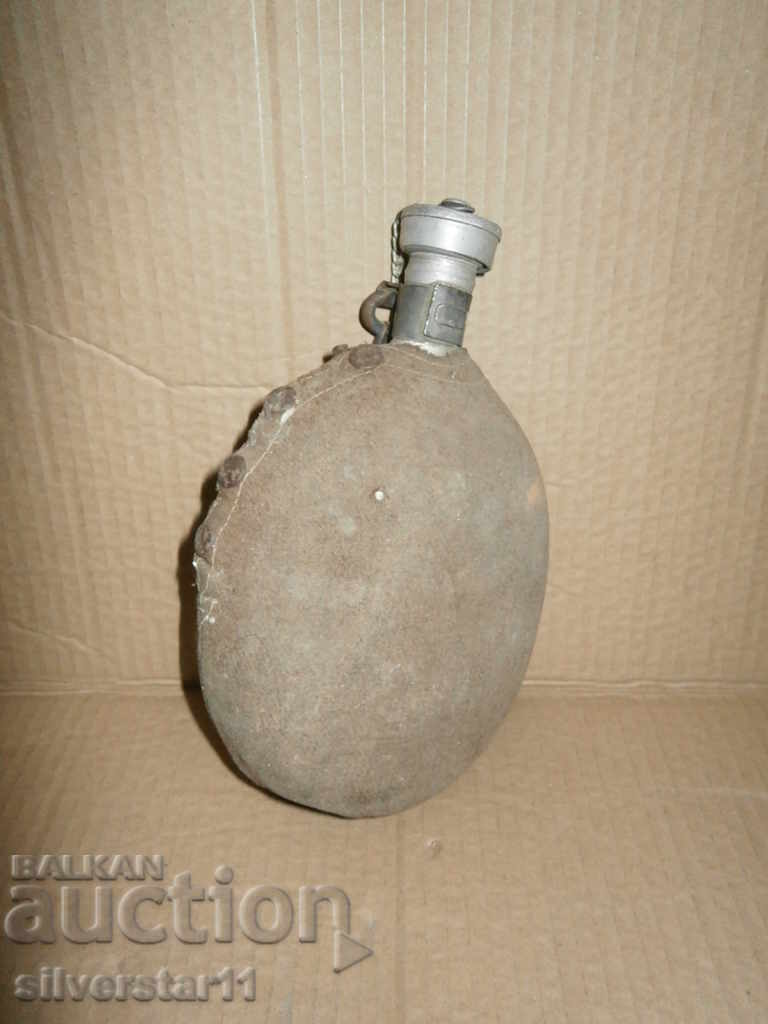 an old flask with a washer original