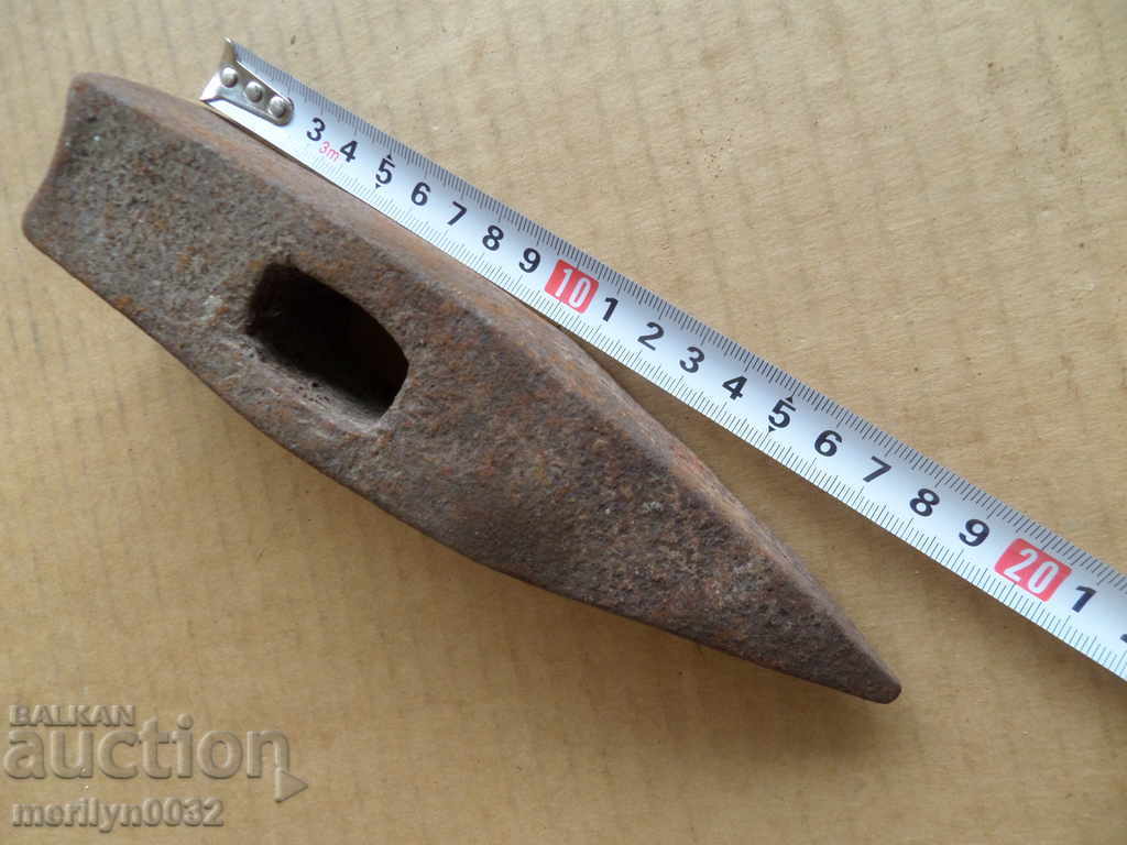 Delivery of An old stone hammer, a tool, a kink Delivery of An old stone hammer, a tool, a kink