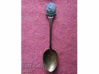 An old English silver spoon with enamel
