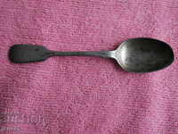 Silver spoon with markings
