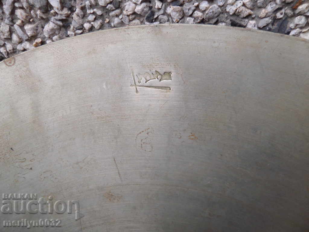 Auction An old cymbal struck a tapped instrument Auction An old cymbal struck a tapped instrument