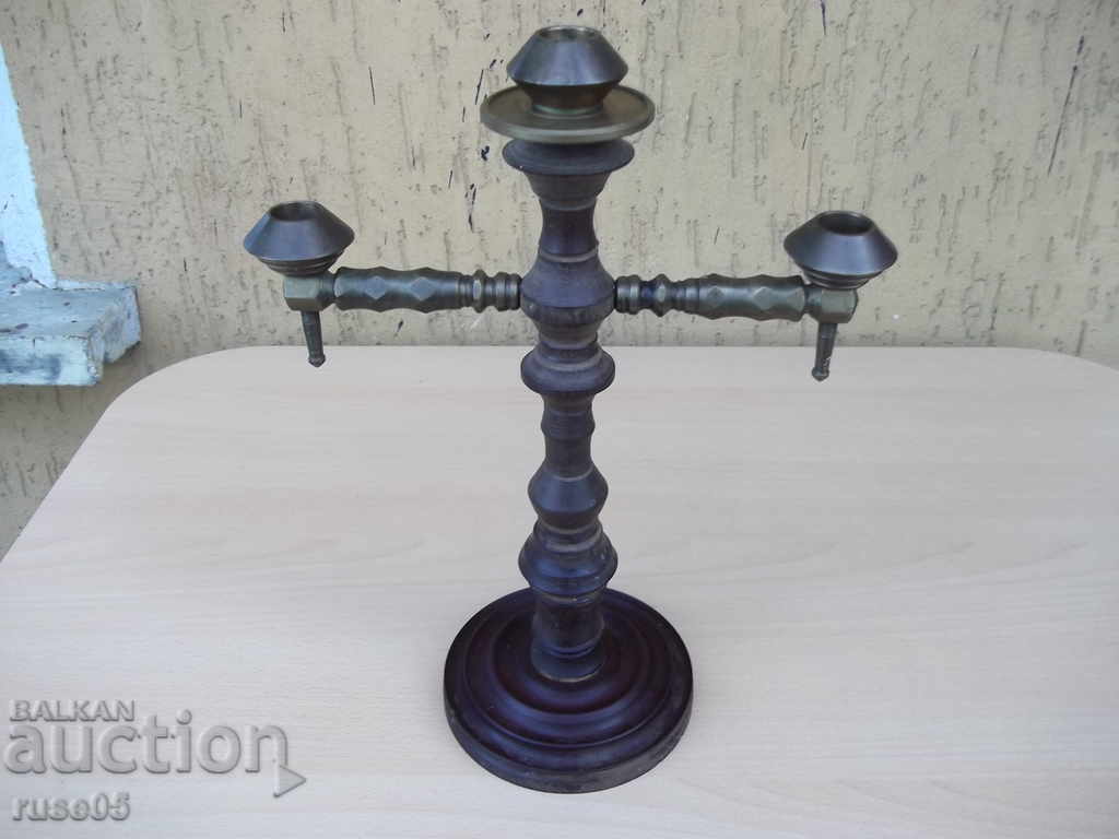 Candlestick made of bronze and three-candle textolite