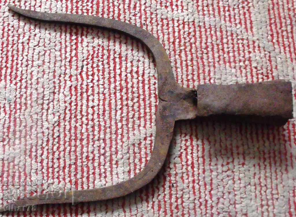 Delivery of an old-wrought iron agricultural instrument