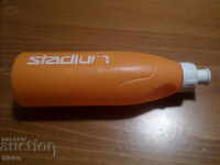 Orange PVC bottle