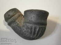 an ancient ceramic pipe