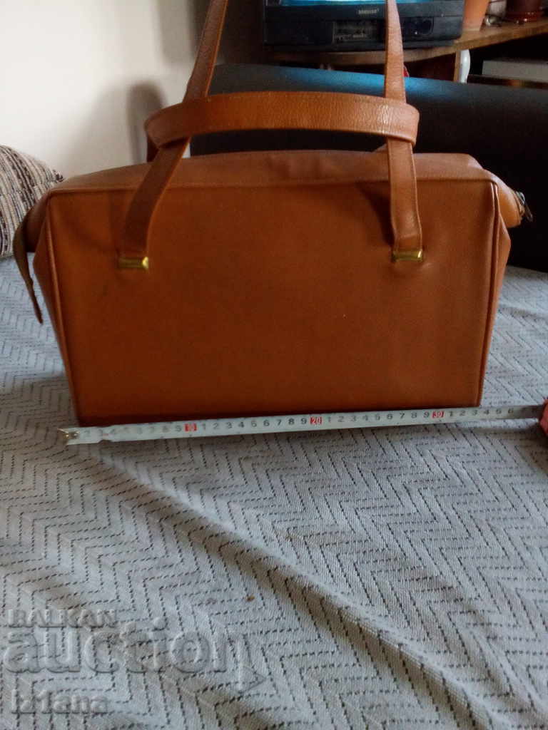 Auction An old leather luggage bag Auction An old leather luggage bag