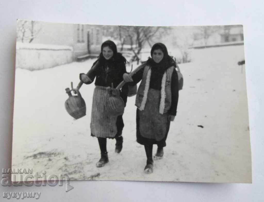 Ancient photograph - women carry water jugs