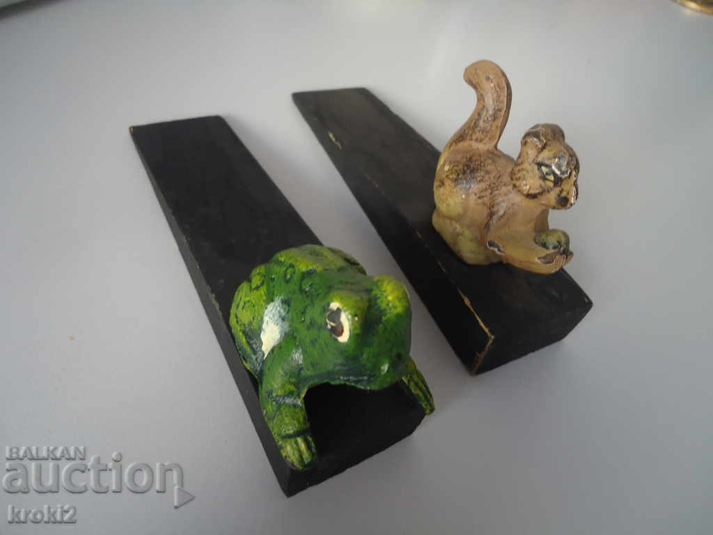 Two cast iron door stoppers on a wooden frog base with price 25.00 BGN | € 12.78 Two cast iron door stoppers on a wooden frog base with price 25.00 BGN | € 12.78
