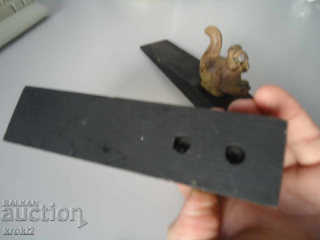 Delivery of Two cast iron door stoppers on a wooden frog base Delivery of Two cast iron door stoppers on a wooden frog base