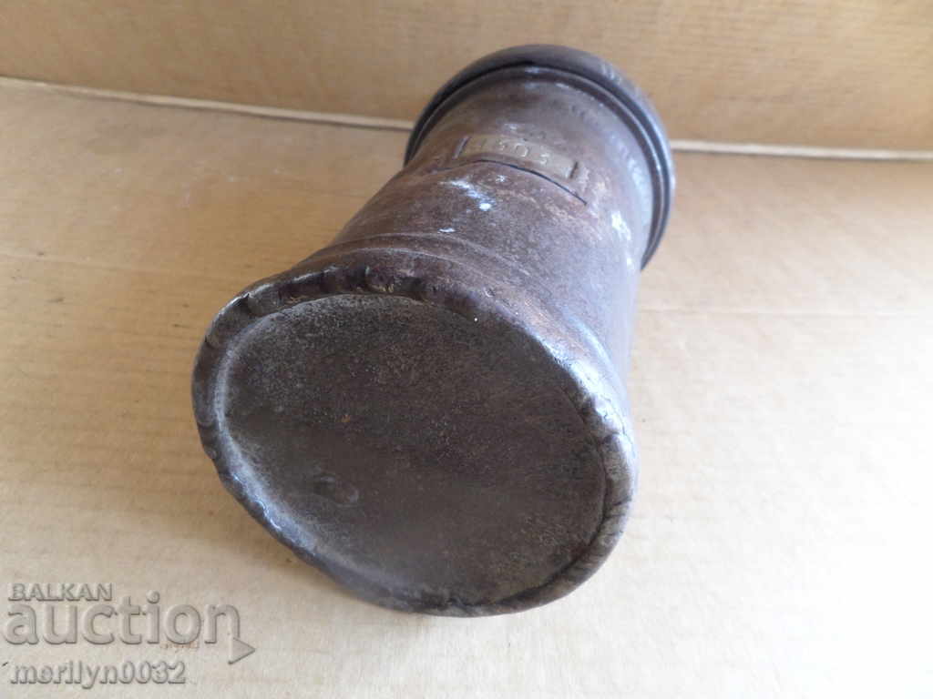 Auction  An old carbide mining lamp, a flashlight projector