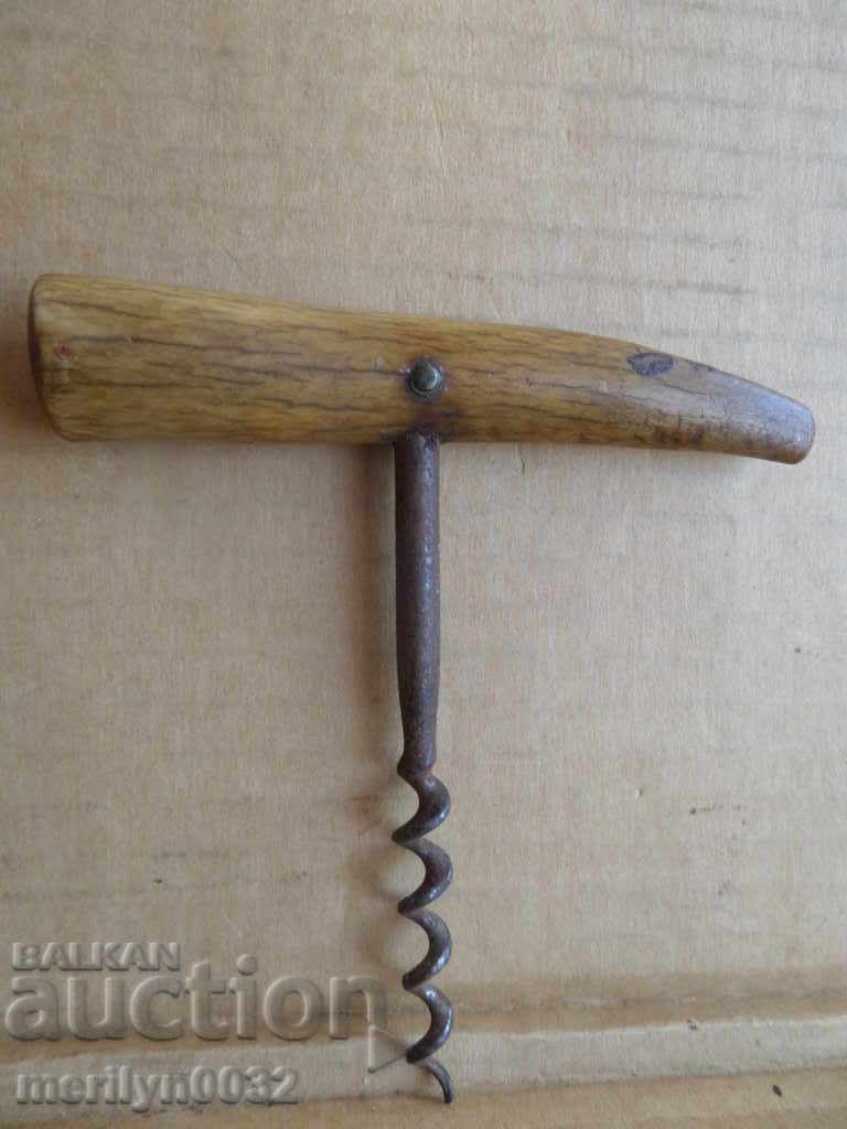 An old 100-year-old corkscrew with a horn handle