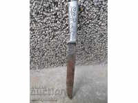Old butcher knife with metal engraved scraps of karaoke dagger