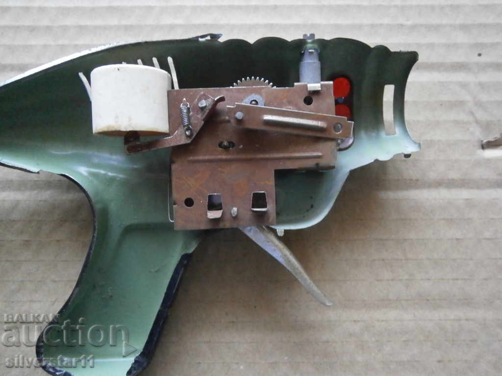 Auction LAMINATED TOY SPRING PISTOL Auction LAMINATED TOY SPRING PISTOL