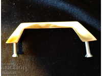 Brass handle for furniture.