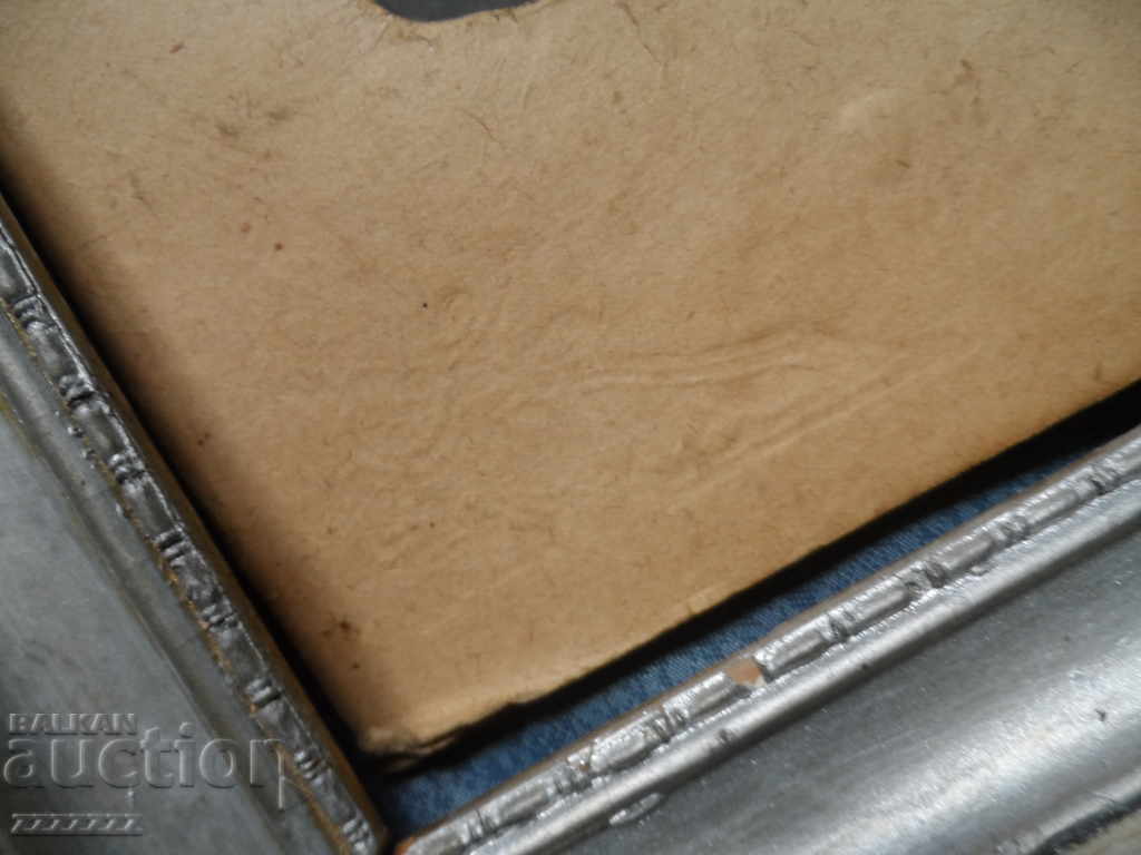 Delivery of Large old colored cardboard photo in a frame