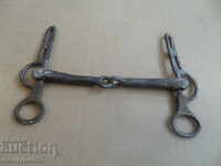 Old forged bridle reins wrought iron, harness