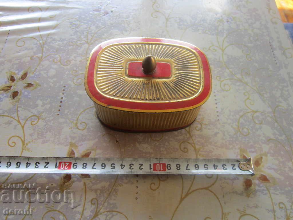 An old tin box for tobacco cigarette jewelry