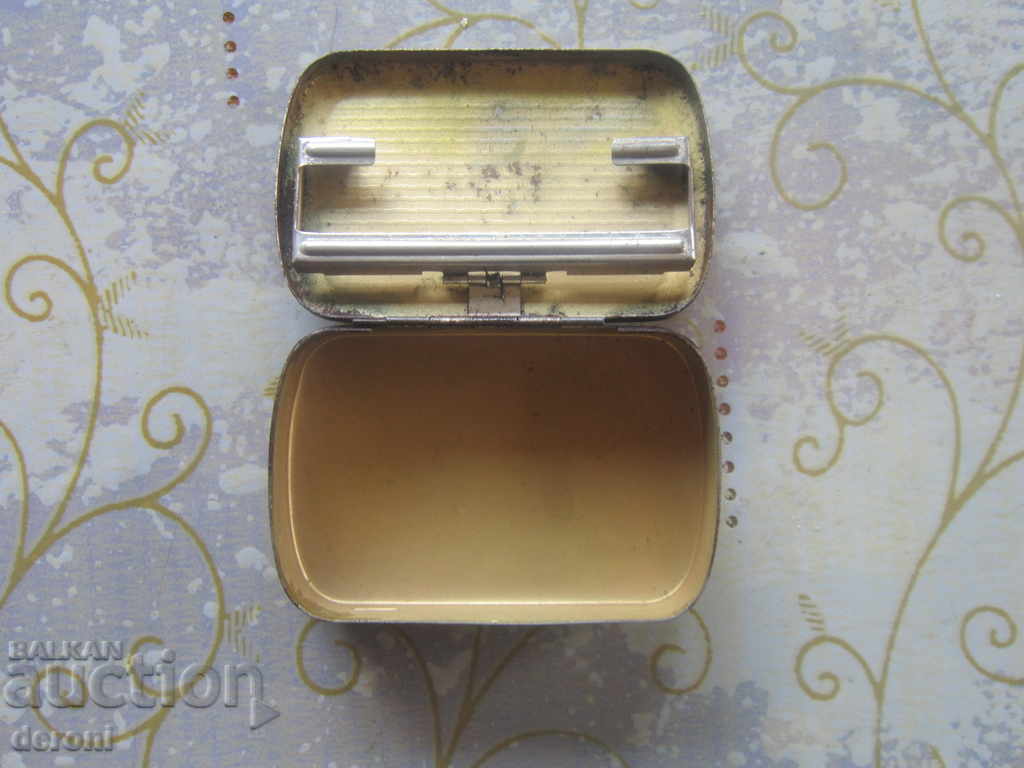Delivery of An old tin tobacco box