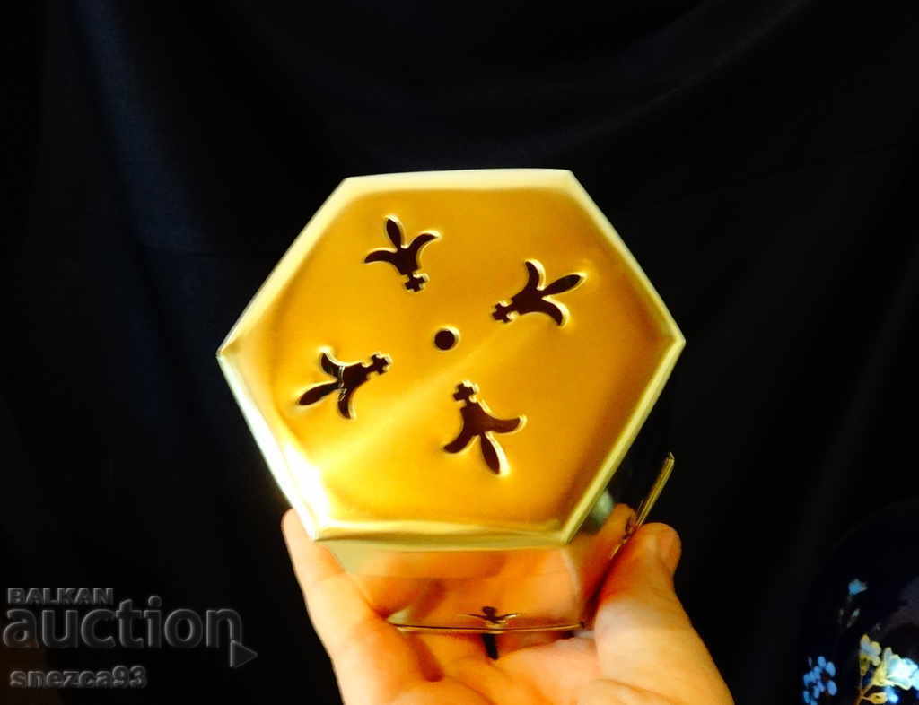 Auction Candlestick, brass candlestick with bourbon lily. Auction Candlestick, brass candlestick with bourbon lily.