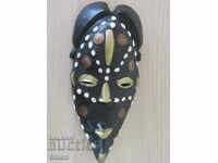 African mask with kobo and bronze