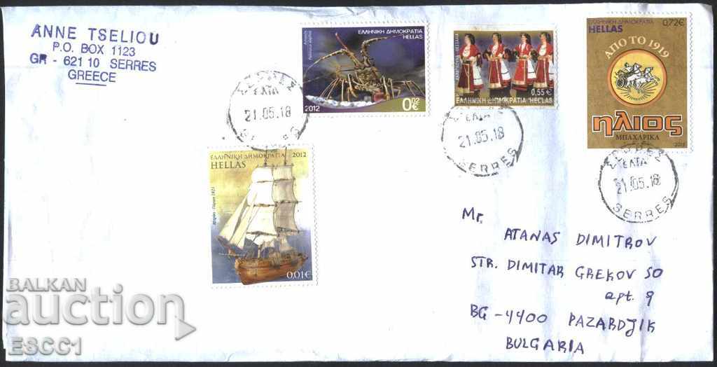 Traveled envelope with the marks Fauna 2012 Folklore from Greece