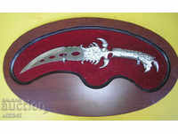 Decorative knife with wooden wall holder