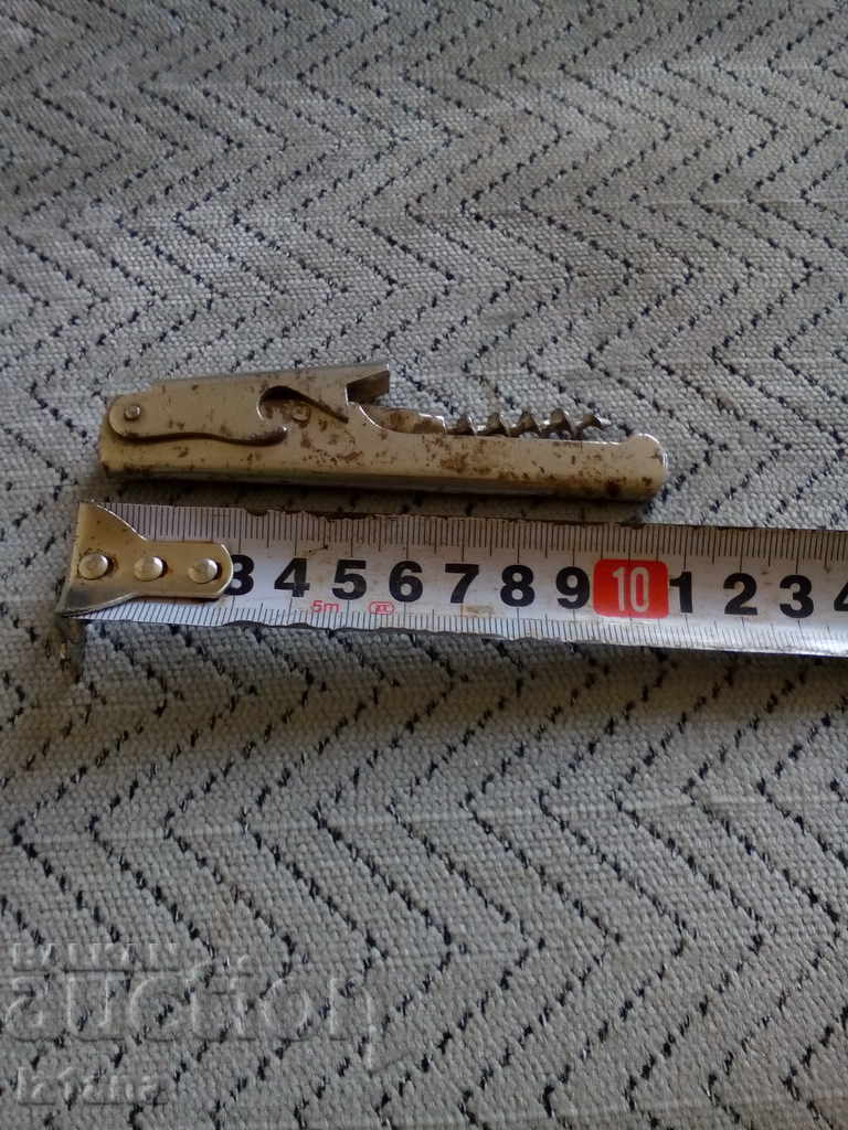 An old bottle opener with price 5.00 BGN | € 2.56