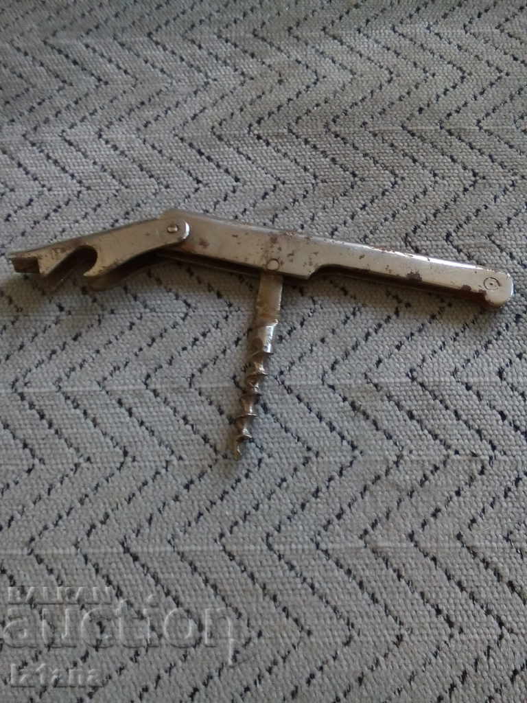 Auction  An old bottle opener